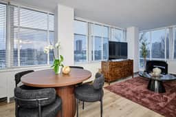 Modern 2BR w/ City View  *Fast Wi-Fi + Gym