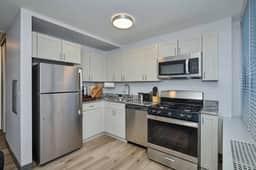 Modern 2BR w/ City View  *Fast Wi-Fi + Gym